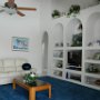 The ceiling fan offers a gentle cooling breeze ideal for relaxing after a tiring day.
